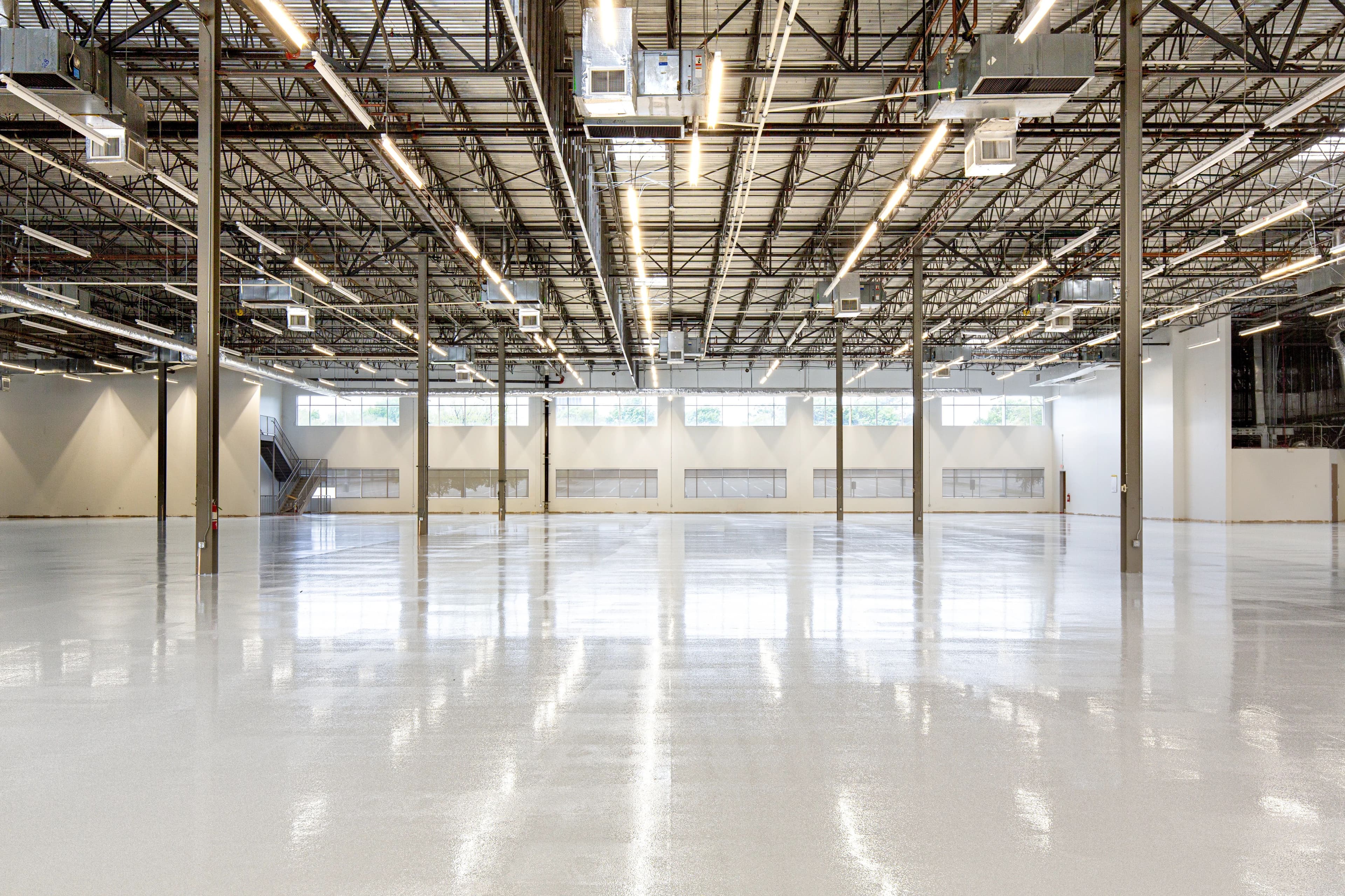 Placeholder image of a clean polished concrete warehouse floor with marked aisles